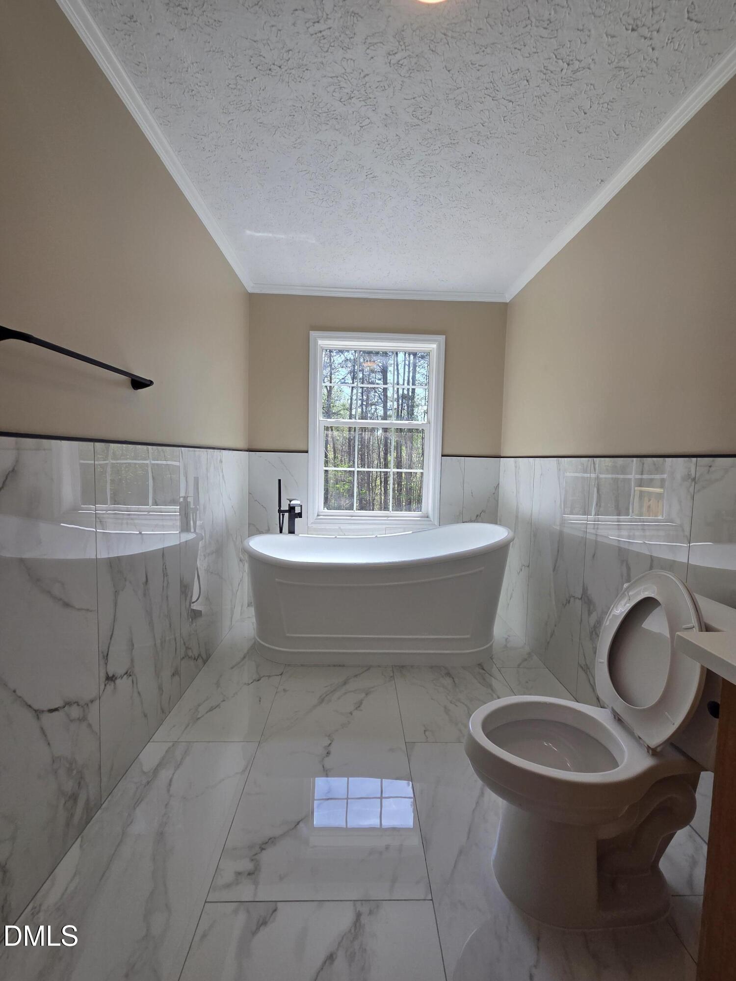 664 Glebe Road Henderson, NC 27537 - Photo 31 of 44 a bathroom with a bathtub and sink