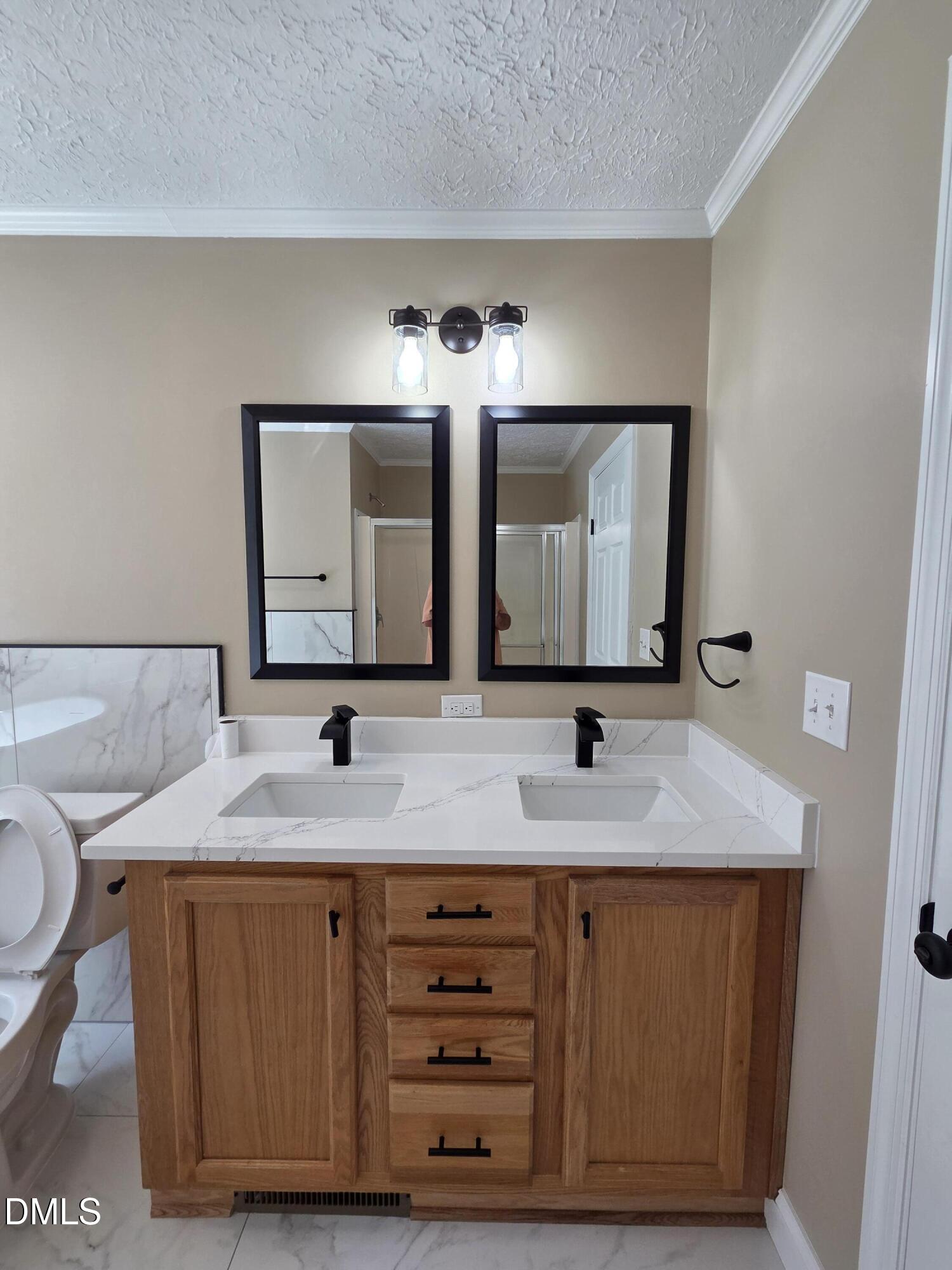 664 Glebe Road Henderson, NC 27537 - Photo 32 of 44 a bathroom with a granite countertop sink and a mirror