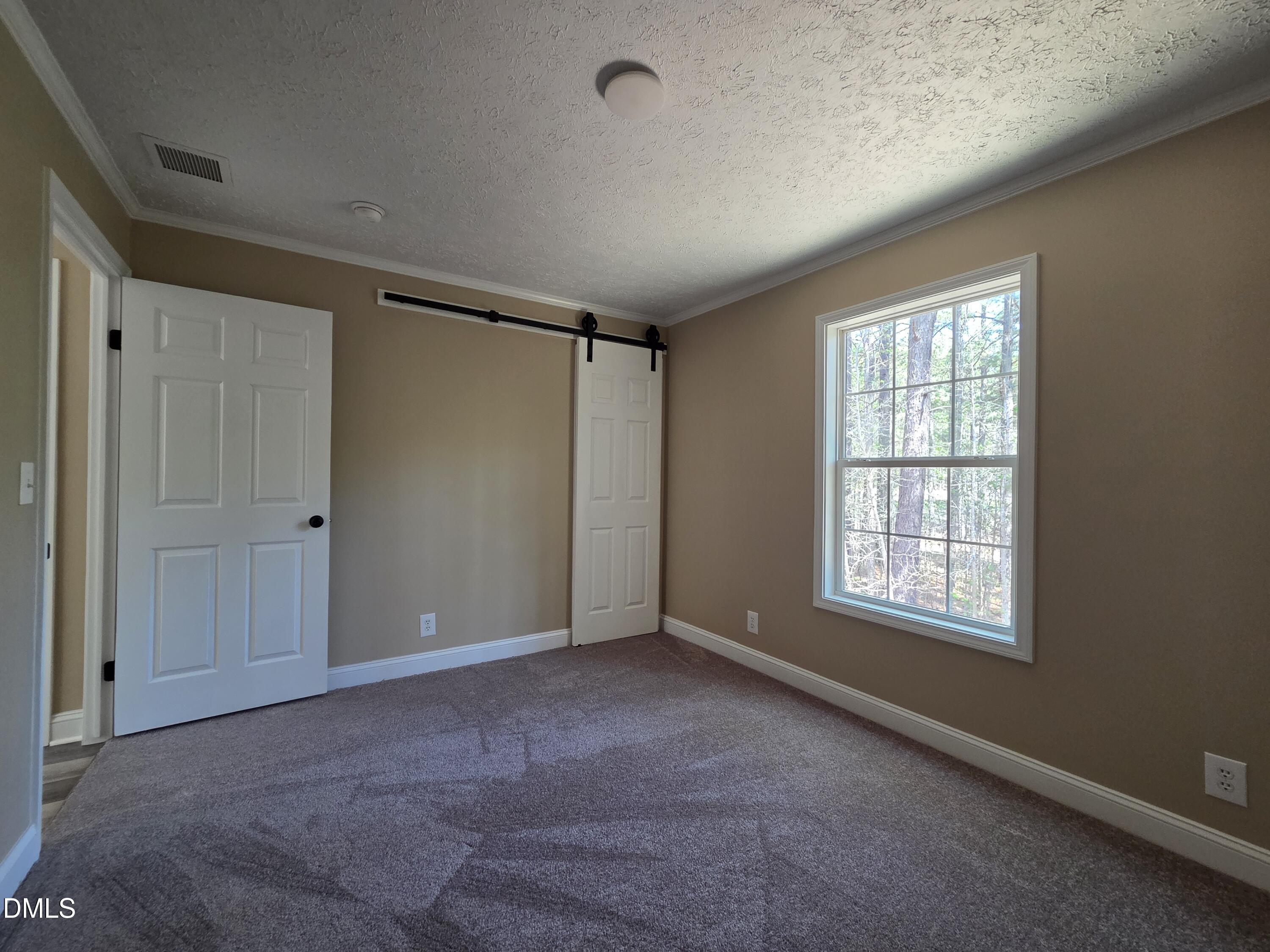 664 Glebe Road Henderson, NC 27537 - Photo 37 of 44 a view of an empty room with a window