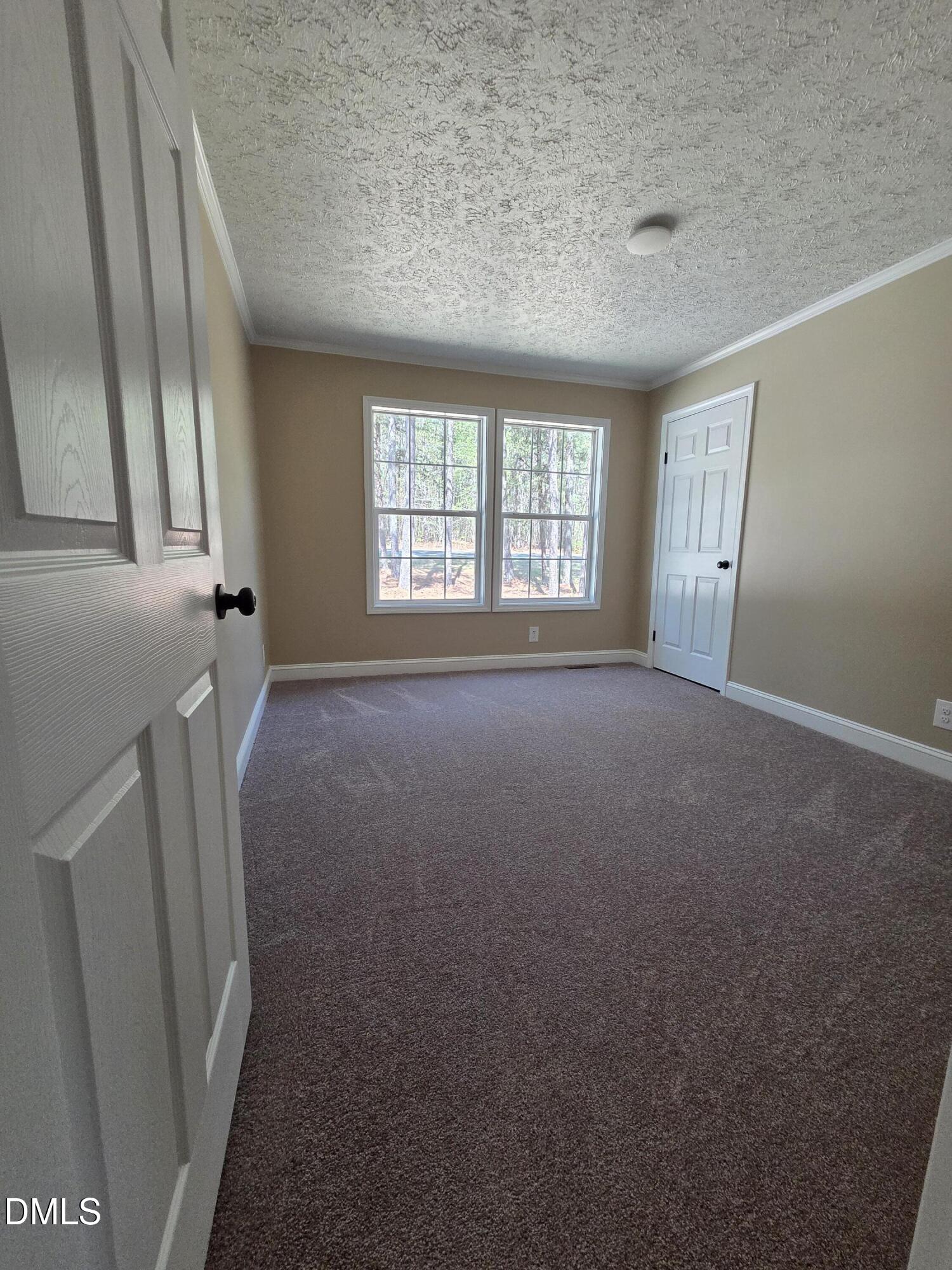 664 Glebe Road Henderson, NC 27537 - Photo 38 of 44 an empty room with windows