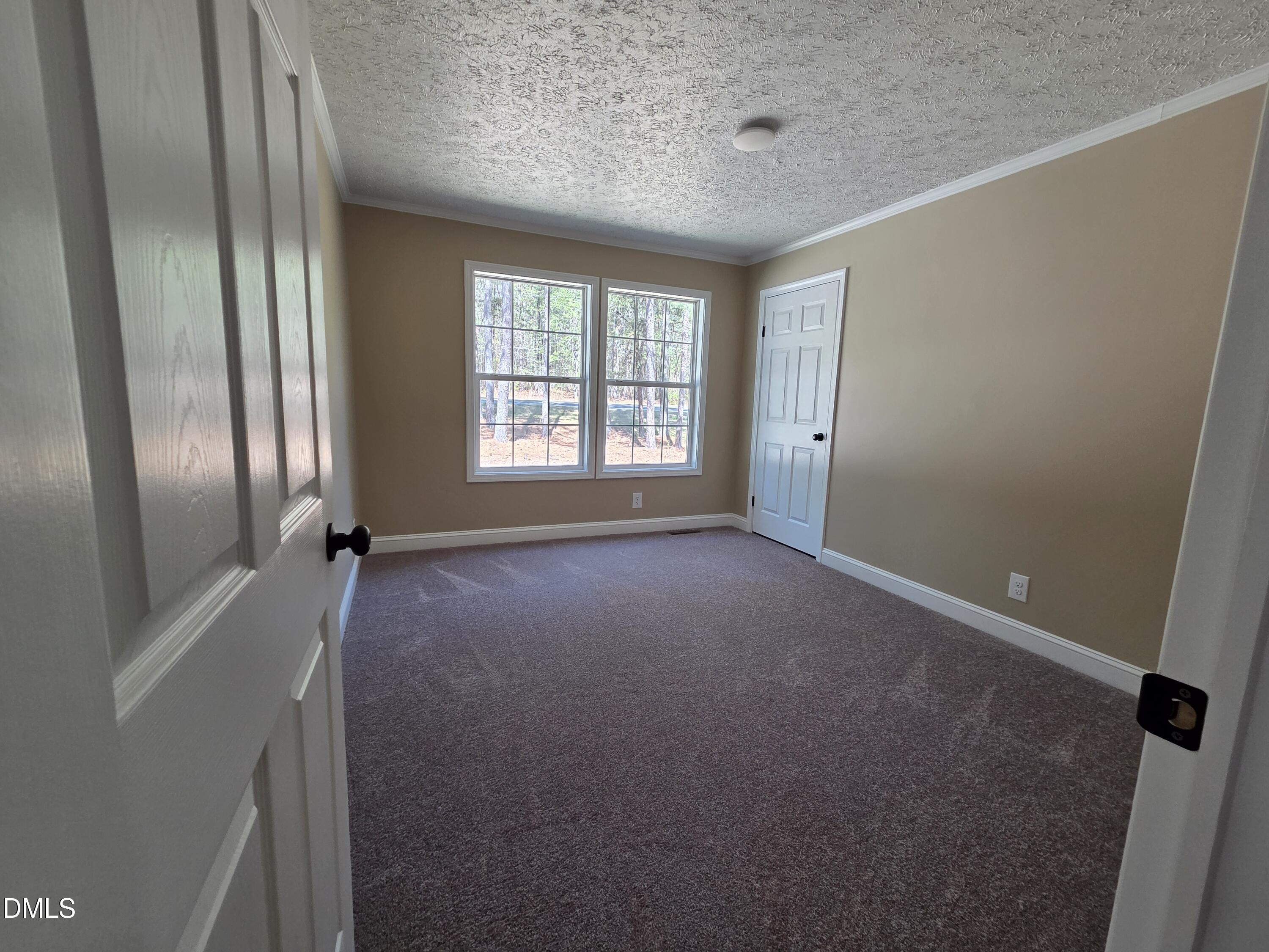 664 Glebe Road Henderson, NC 27537 - Photo 39 of 44 a view of an empty room with a window