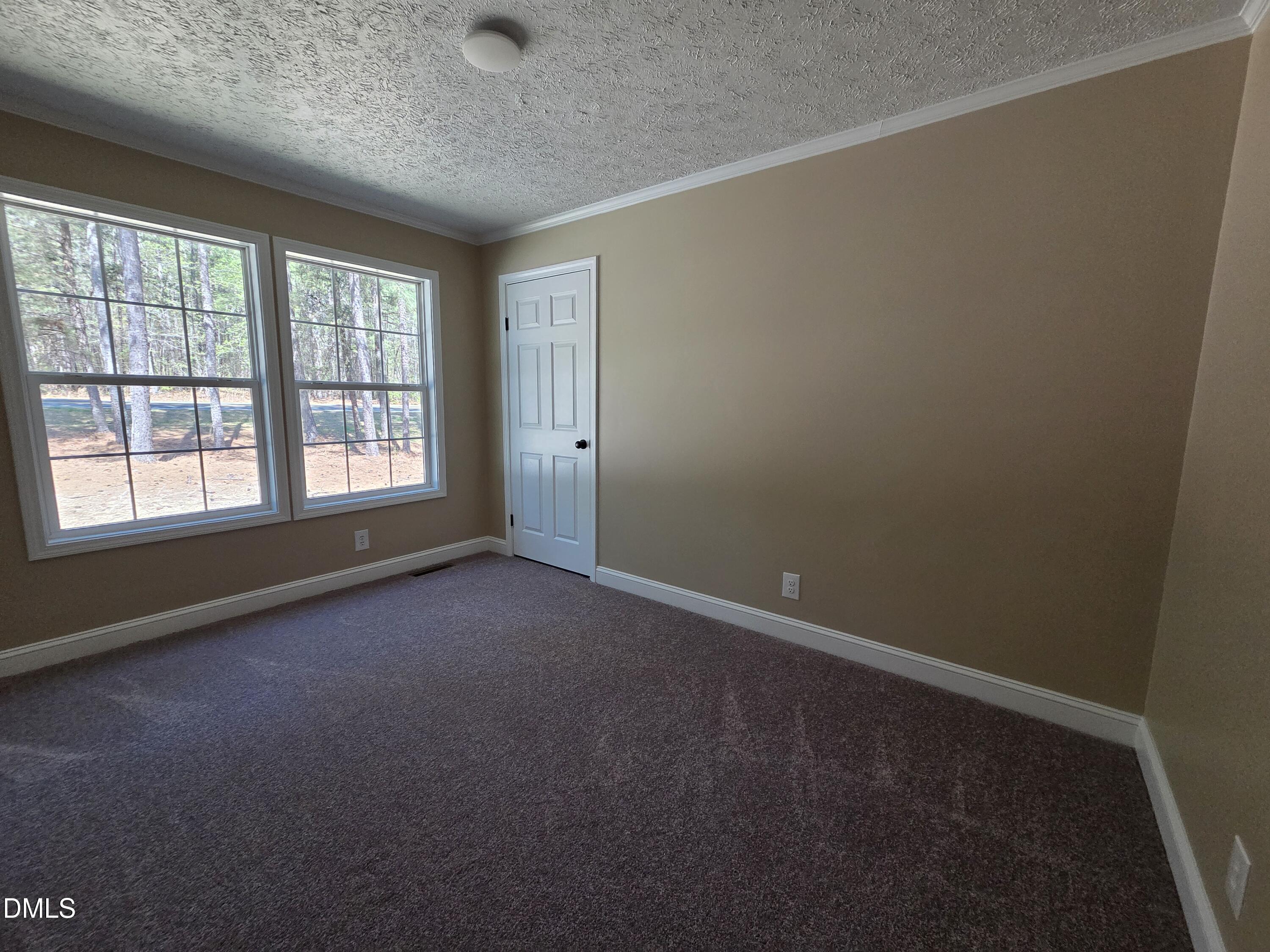 664 Glebe Road Henderson, NC 27537 - Photo 40 of 44 an empty room with a empty space and windows