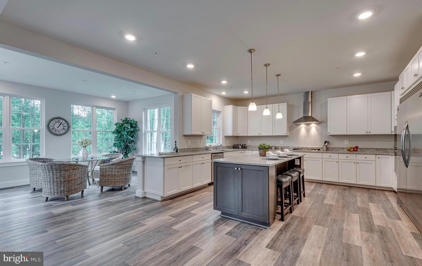 6709 Deep Run Trail Hanover, MD 21076 - Photo 8 of 12 a kitchen with lots of counter top space and refrigerator