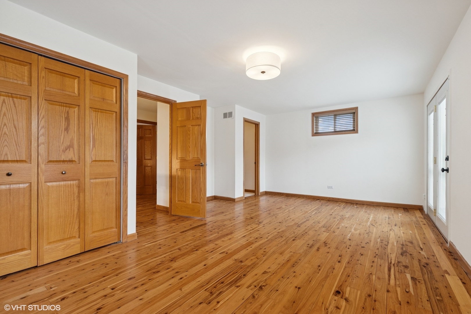 701 North Harrison Street Algonquin, IL 60102 - Photo 11 of 28 an empty room with wooden floor and windows