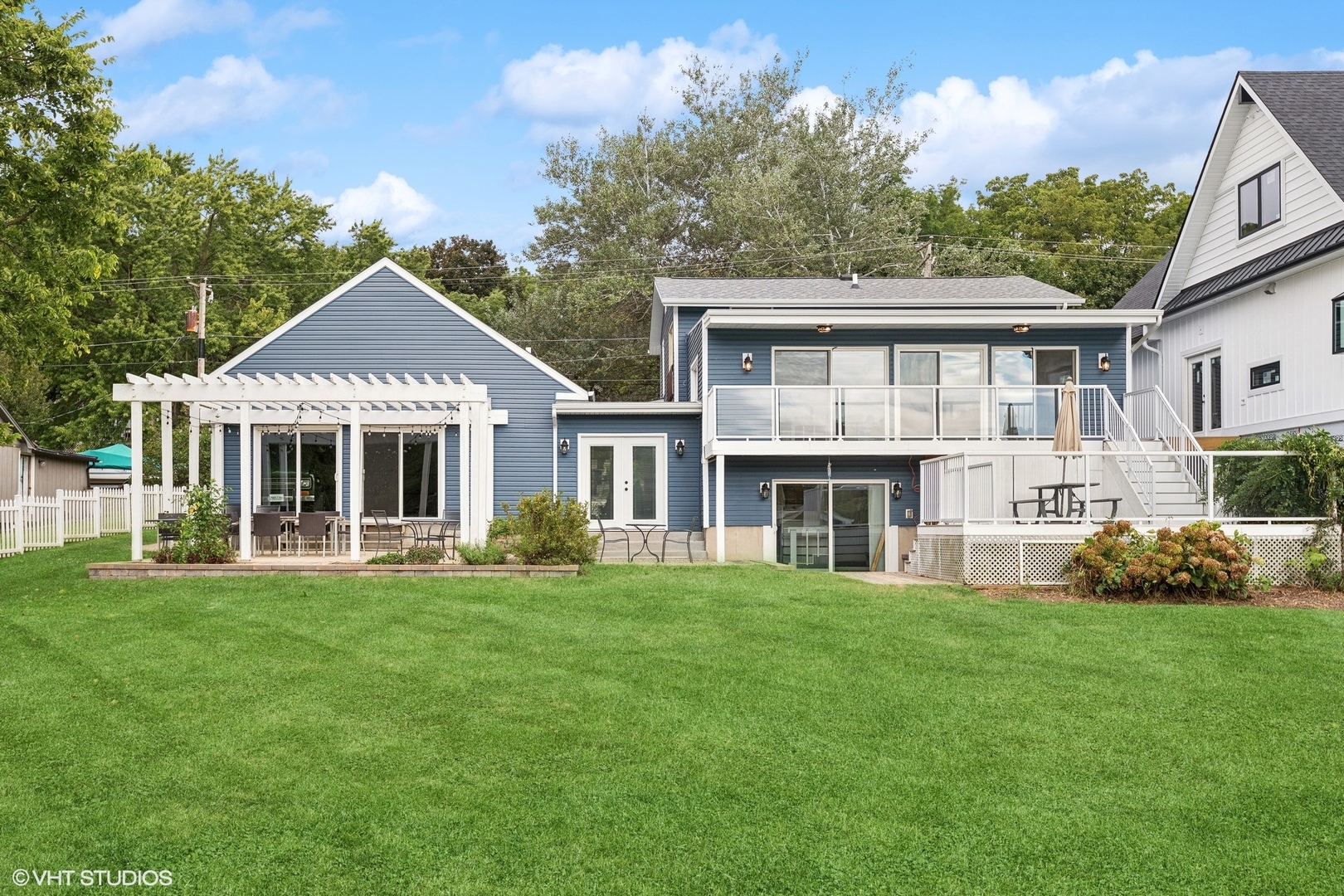 701 North Harrison Street Algonquin, IL 60102 - Photo 17 of 28 a front view of a house with a garden