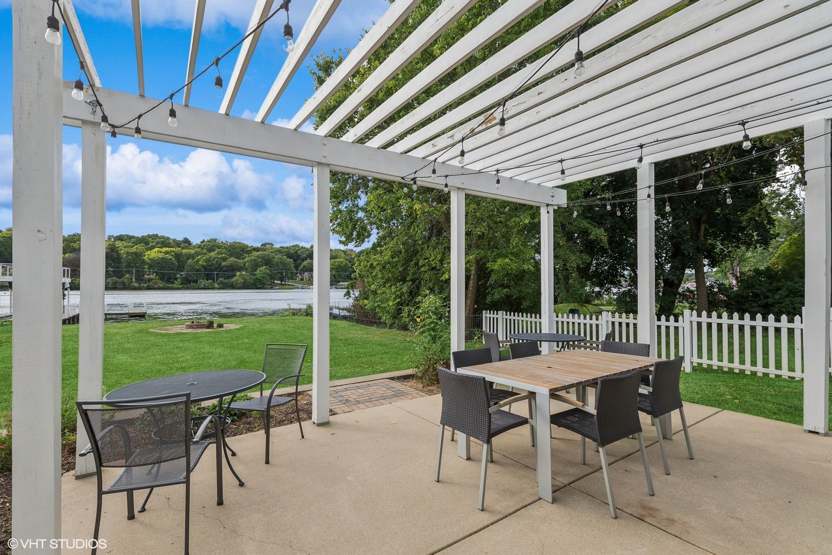 701 North Harrison Street Algonquin, IL 60102 - Photo 18 of 28 a table and chairs sitting in front of a house