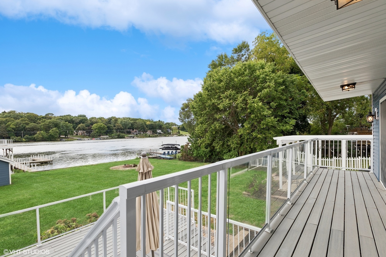 701 North Harrison Street Algonquin, IL 60102 - Photo 20 of 28 a view of a balcony with wooden floor and fence