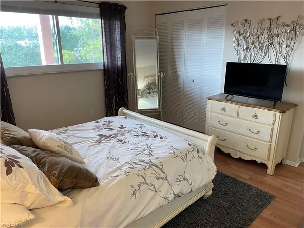 a white refrigerator freezer and a stove sitting inside of a kitchen