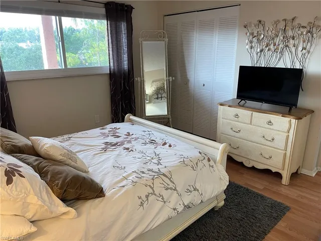 a white refrigerator freezer and a stove sitting inside of a kitchen