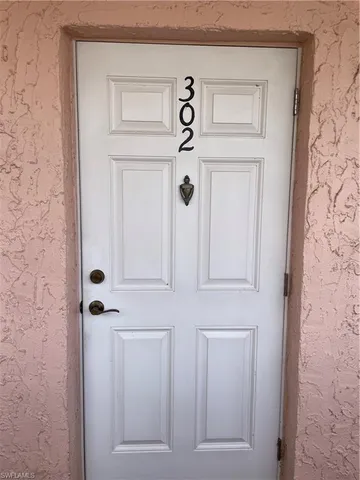 a view of a hallway with front door