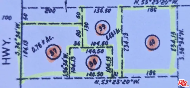 an aerial view of a residential apartment building with yard