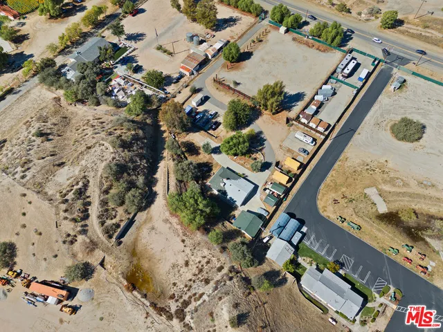 an aerial view of residential house with outdoor space