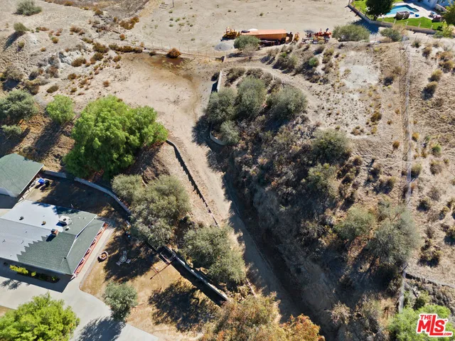 an aerial view of residential house with outdoor space