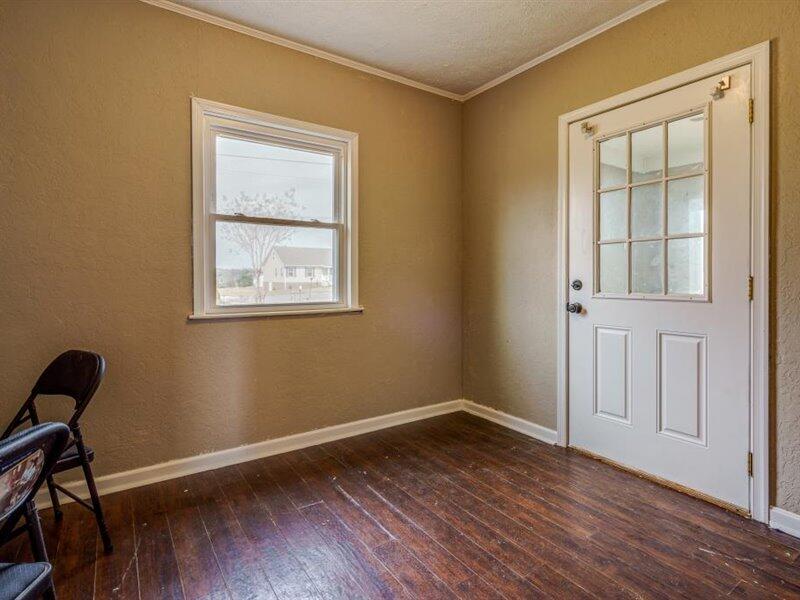 2331 Callaway Road Rocky Mount, VA 24151 - Photo 12 of 26 a view of an empty room with wooden floor and a window