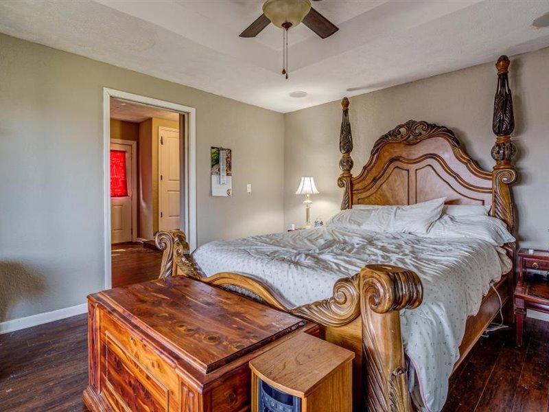 2331 Callaway Road Rocky Mount, VA 24151 - Photo 18 of 26 a bedroom with a bed and dresser with wooden floor