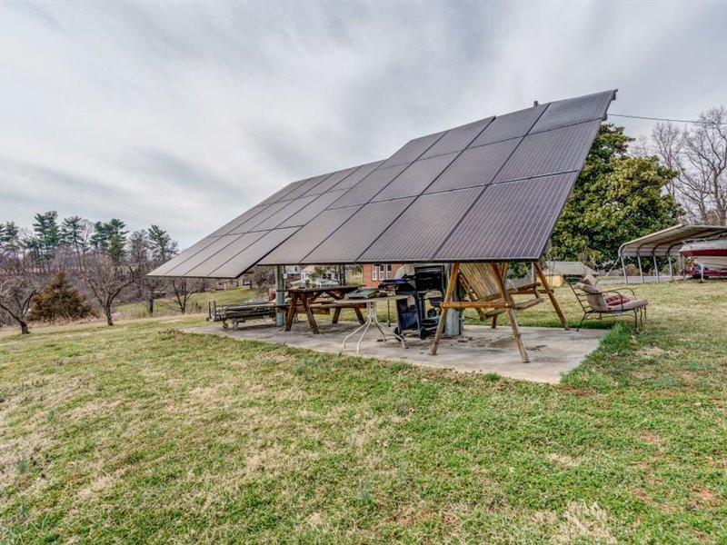 2331 Callaway Road Rocky Mount, VA 24151 - Photo 24 of 26 an outdoor space with patio furniture and white umbrellas