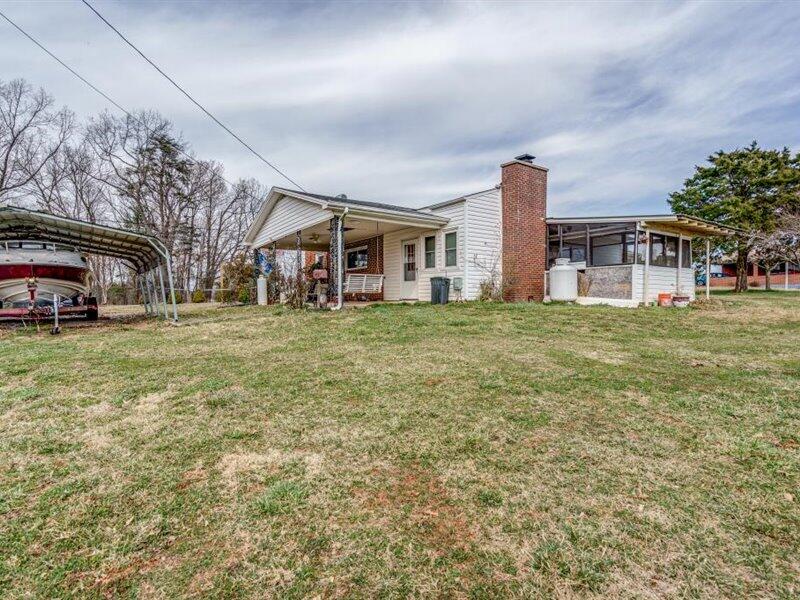 2331 Callaway Road Rocky Mount, VA 24151 - Photo 25 of 26 a view of a house with a big yard and large trees