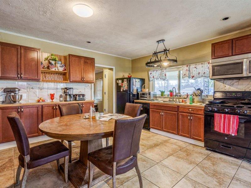 2331 Callaway Road Rocky Mount, VA 24151 - Photo 7 of 26 a kitchen with a dining table chairs and refrigerator