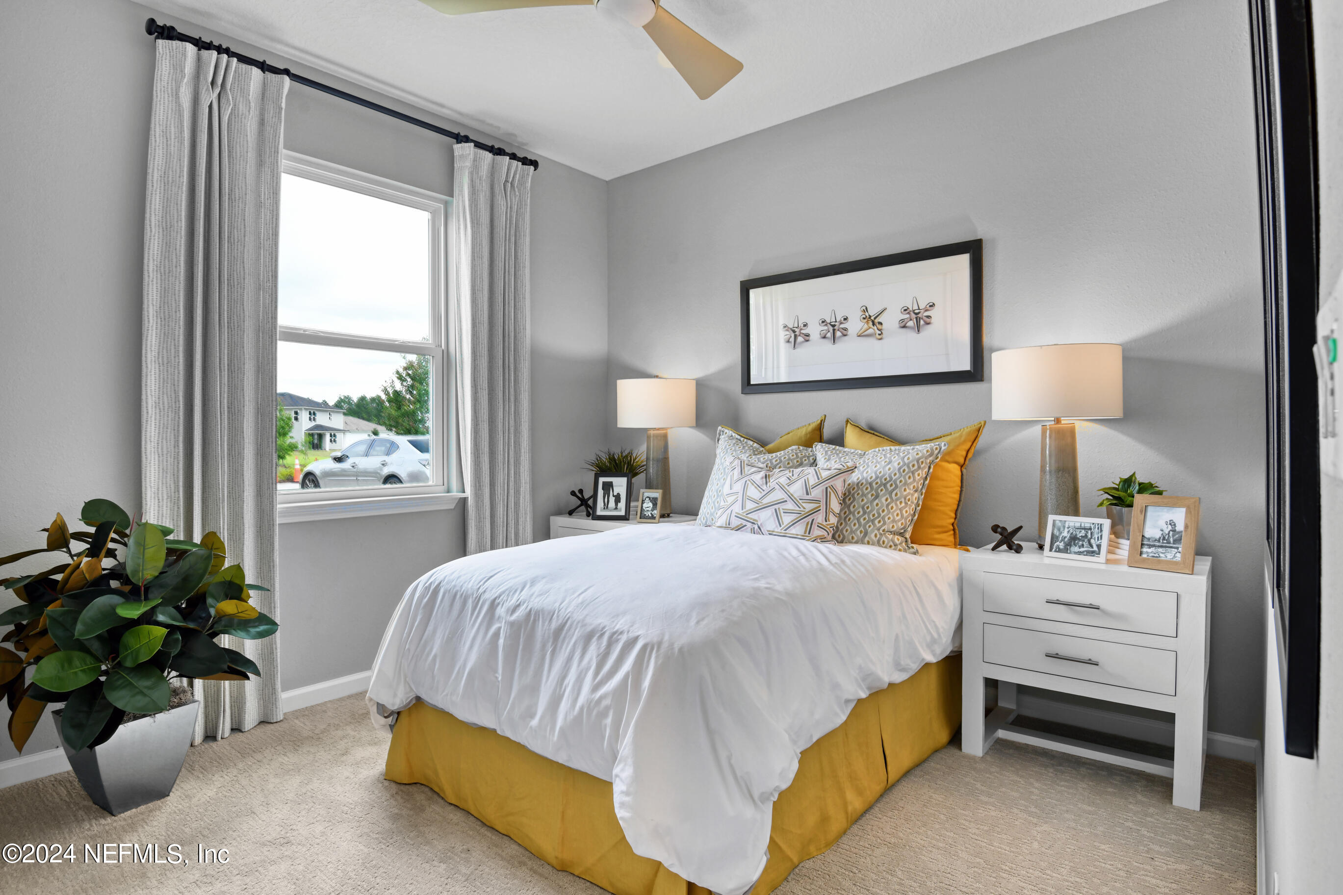 7206 Red Timber Road Jacksonville, FL 32244 - Photo 13 of 18 a bedroom with a bed and a potted plant