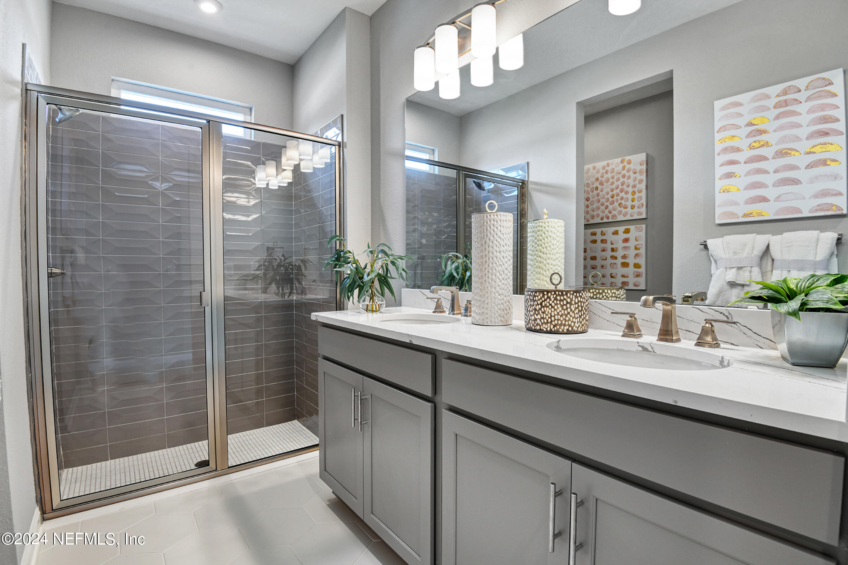 7206 Red Timber Road Jacksonville, FL 32244 - Photo 14 of 18 a bathroom with a granite countertop sink a large mirror and a shower