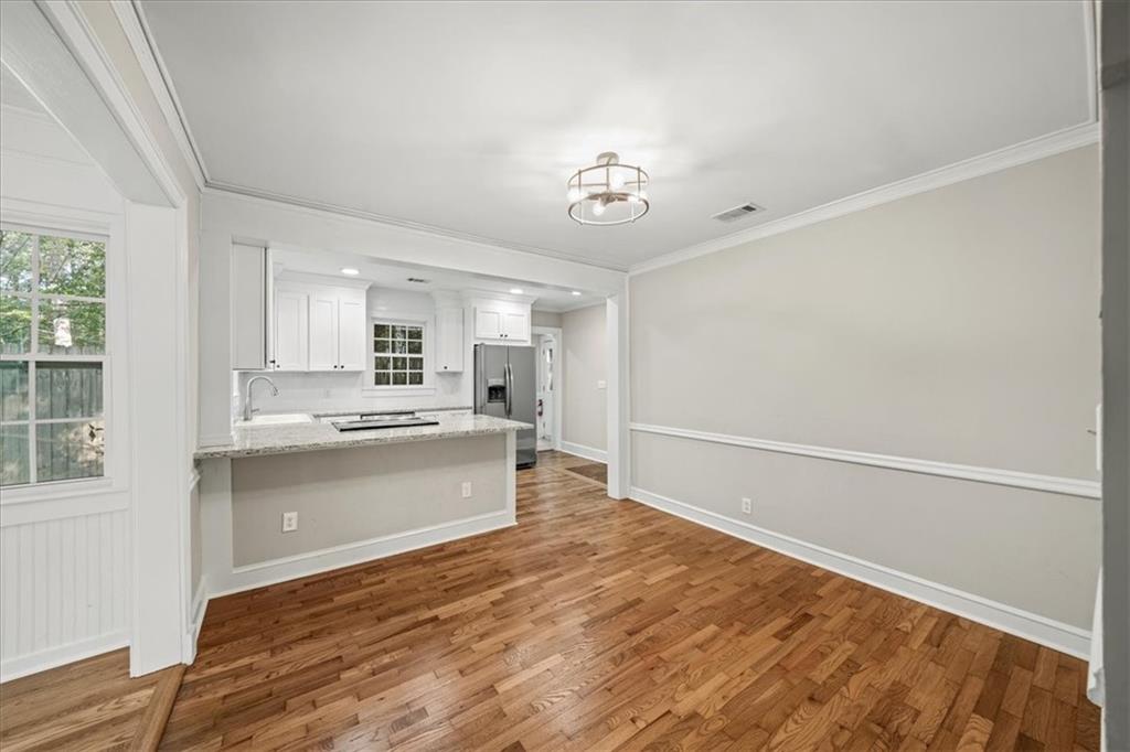 3494 Briarcliff Road Northeast Atlanta, GA 30345 - Photo 13 of 46 a large kitchen with a wooden floor and a large window