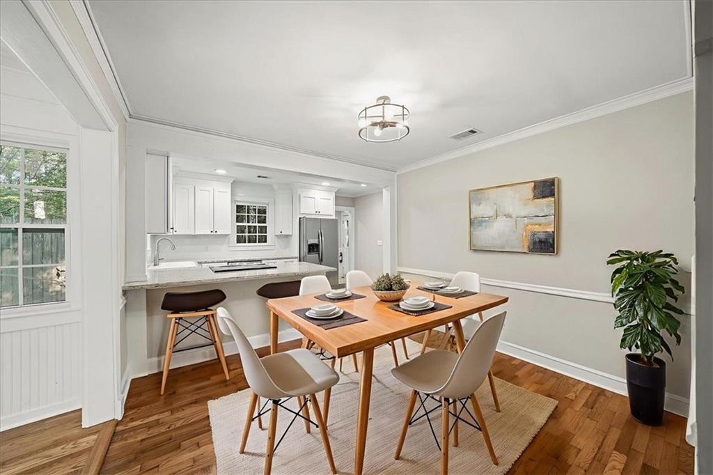 3494 Briarcliff Road Northeast Atlanta, GA 30345 - Photo 14 of 46 a dining room with a wooden table and chairs