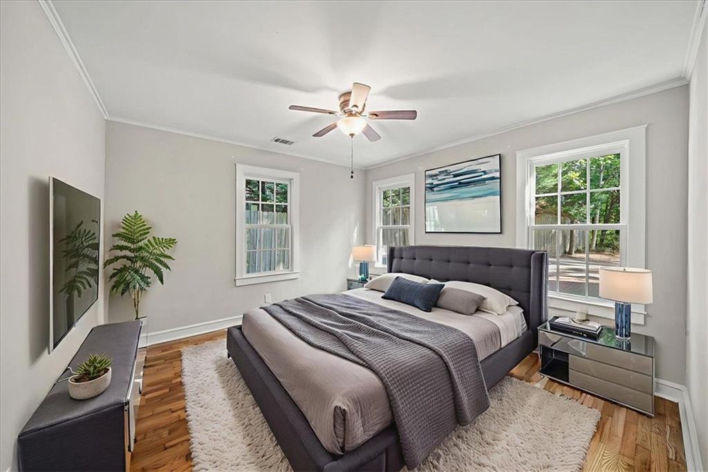 3494 Briarcliff Road Northeast Atlanta, GA 30345 - Photo 27 of 46 a bedroom with bed and a potted plant