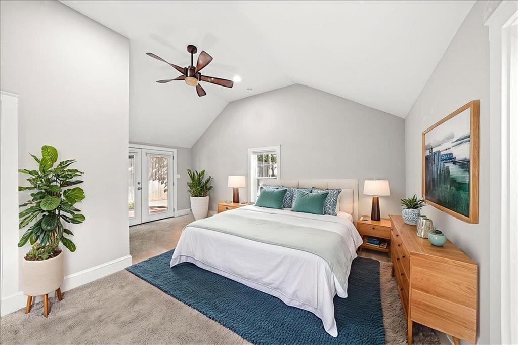 3494 Briarcliff Road Northeast Atlanta, GA 30345 - Photo 30 of 46 a bedroom with a bed table flowerpot and window