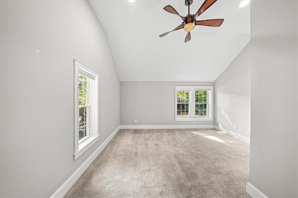 3494 Briarcliff Road Northeast Atlanta, GA 30345 - Photo 31 of 46 an empty room with windows and fan