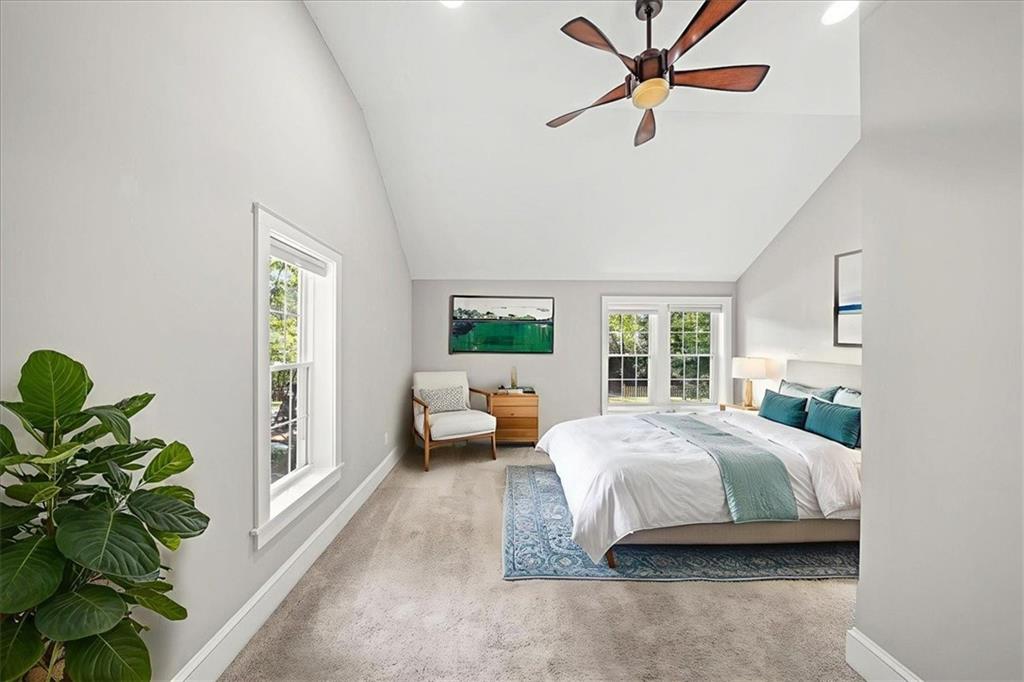 3494 Briarcliff Road Northeast Atlanta, GA 30345 - Photo 32 of 46 a bedroom with a bed furniture and a potted plant