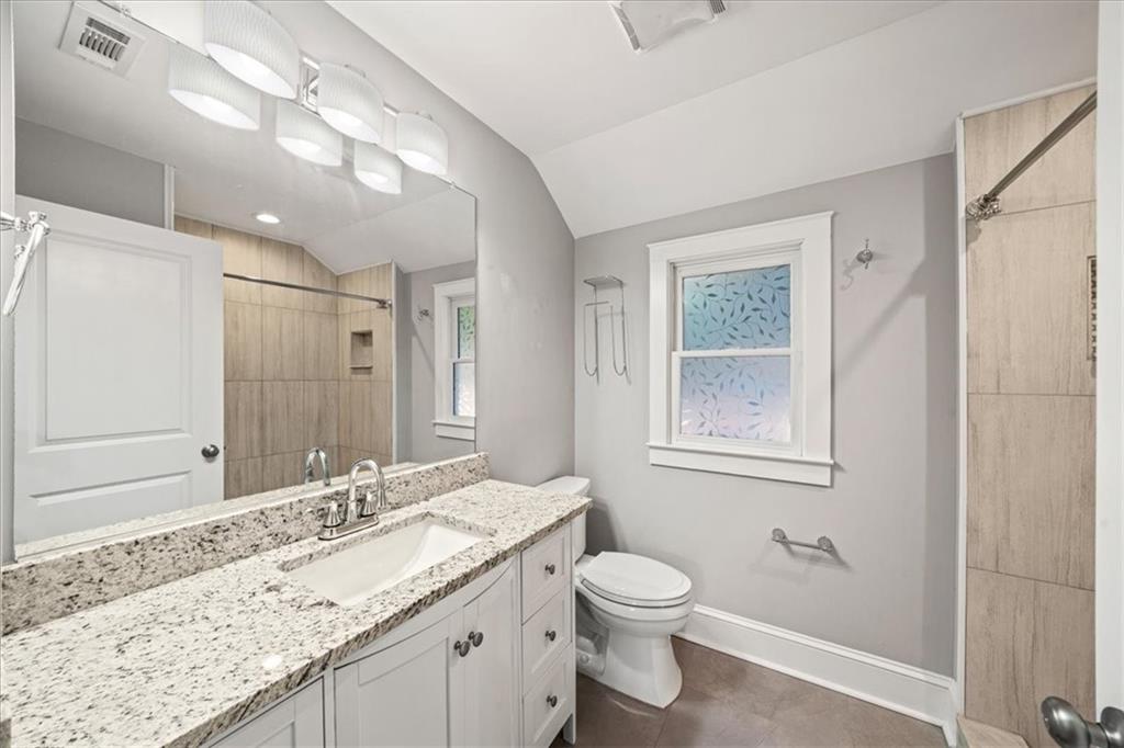 3494 Briarcliff Road Northeast Atlanta, GA 30345 - Photo 34 of 46 a bathroom with a granite countertop sink toilet and shower