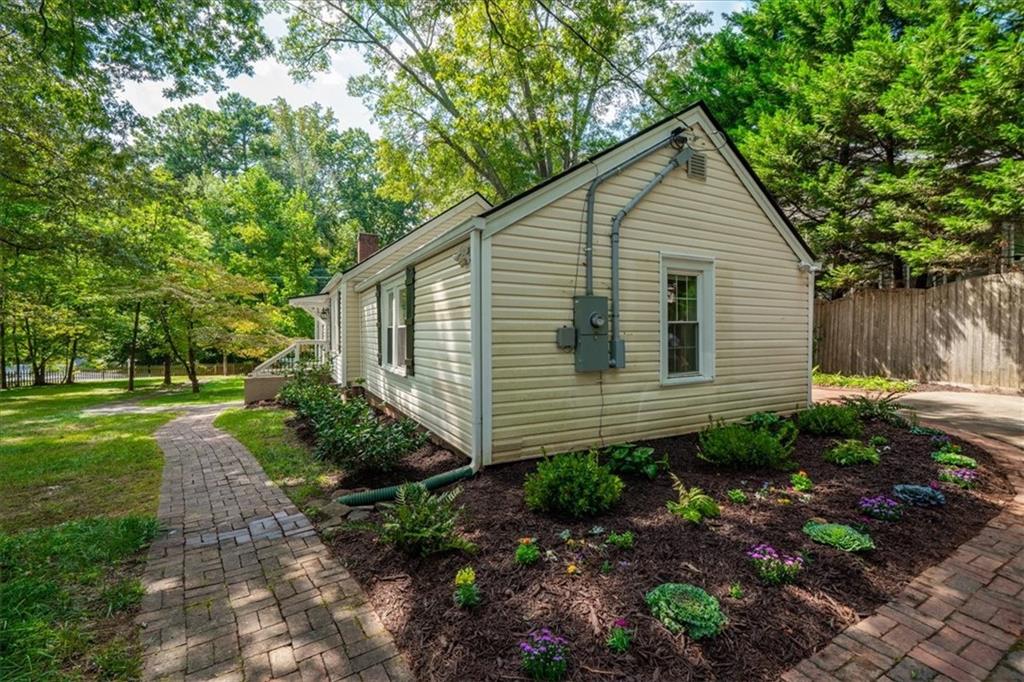 3494 Briarcliff Road Northeast Atlanta, GA 30345 - Photo 38 of 46 a view of a house with yard and a garden
