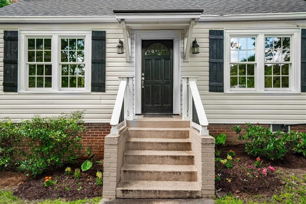 3494 Briarcliff Road Northeast Atlanta, GA 30345 - Photo 39 of 46 a view of a house with potted plants and a table and potted plants