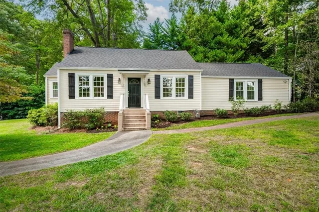 a aerial view of a house with a yard