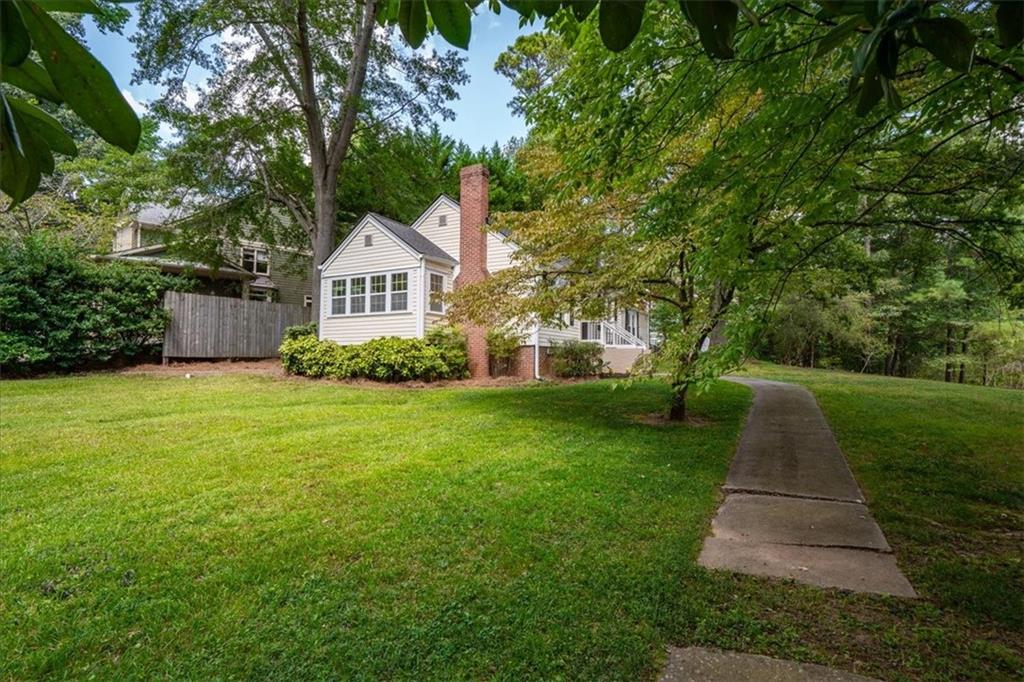 3494 Briarcliff Road Northeast Atlanta, GA 30345 - Photo 43 of 46 a front view of a house with yard and green space