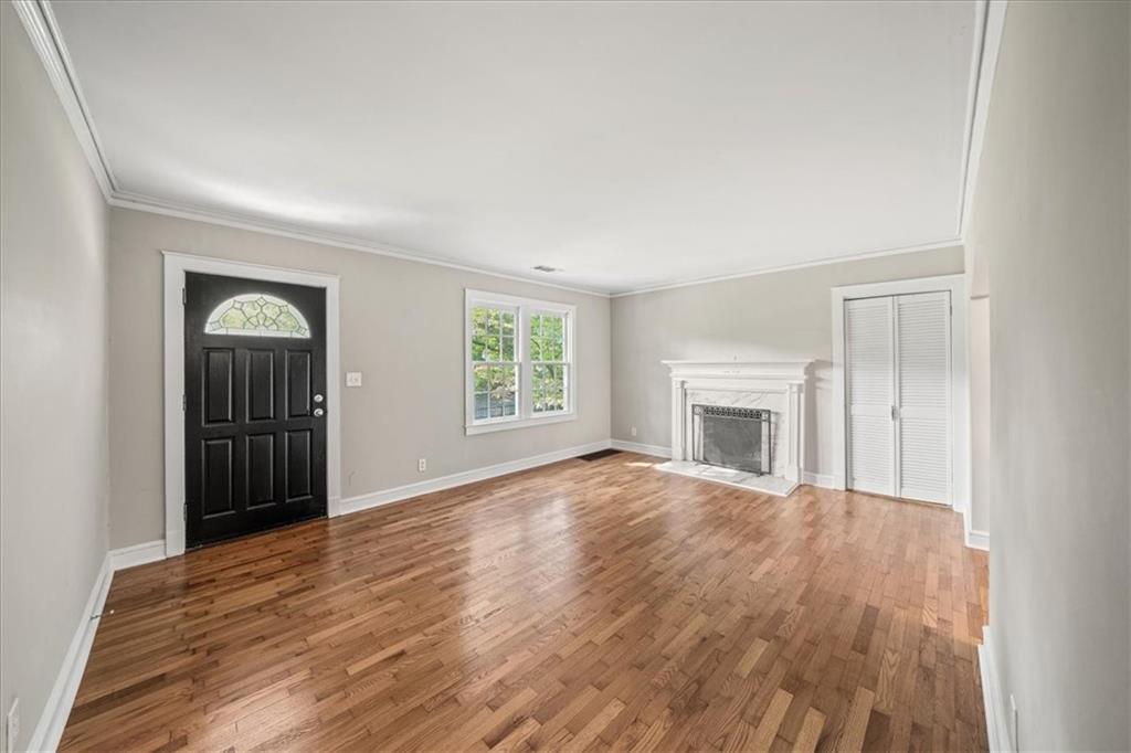 3494 Briarcliff Road Northeast Atlanta, GA 30345 - Photo 8 of 46 an empty room with windows and fireplace