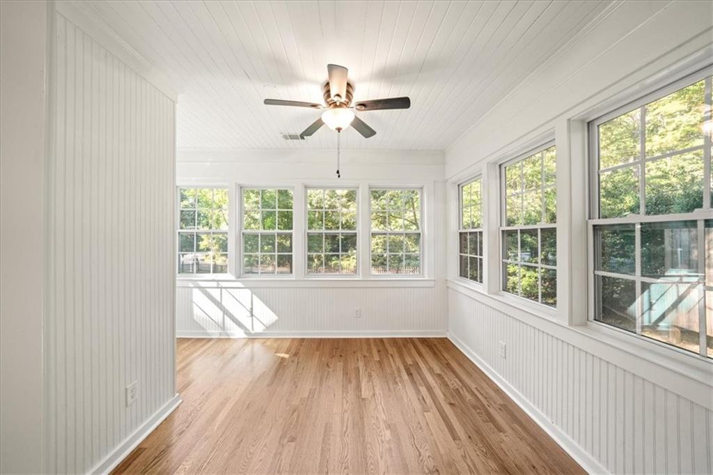 3494 Briarcliff Road Northeast Atlanta, GA 30345 - Photo 10 of 46 a view of empty room with wooden floor and fan