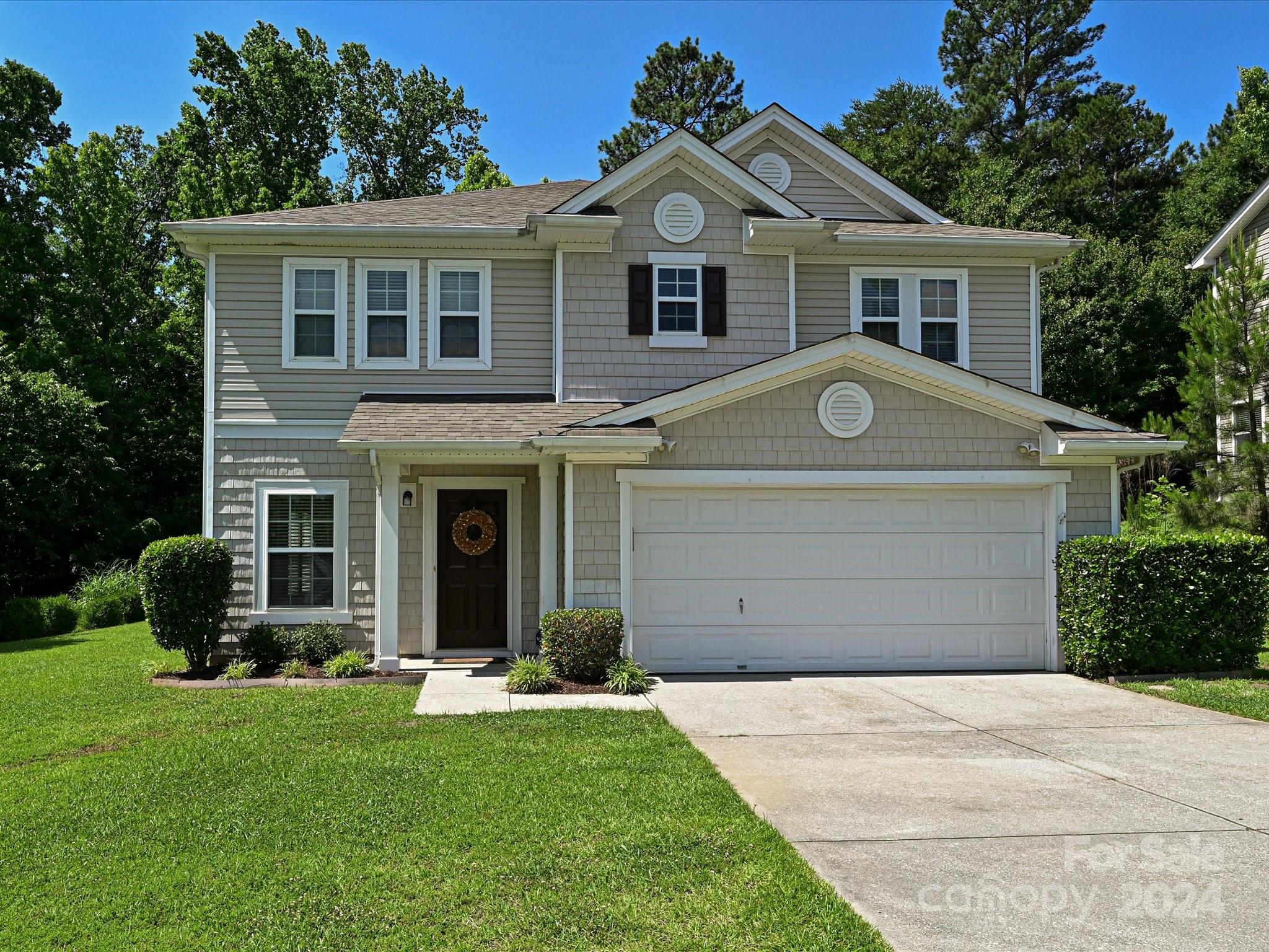 796 Ivy Trail Way Fort Mill, SC 29715 - Photo 1 of 39 a front view of a house with a garden and yard