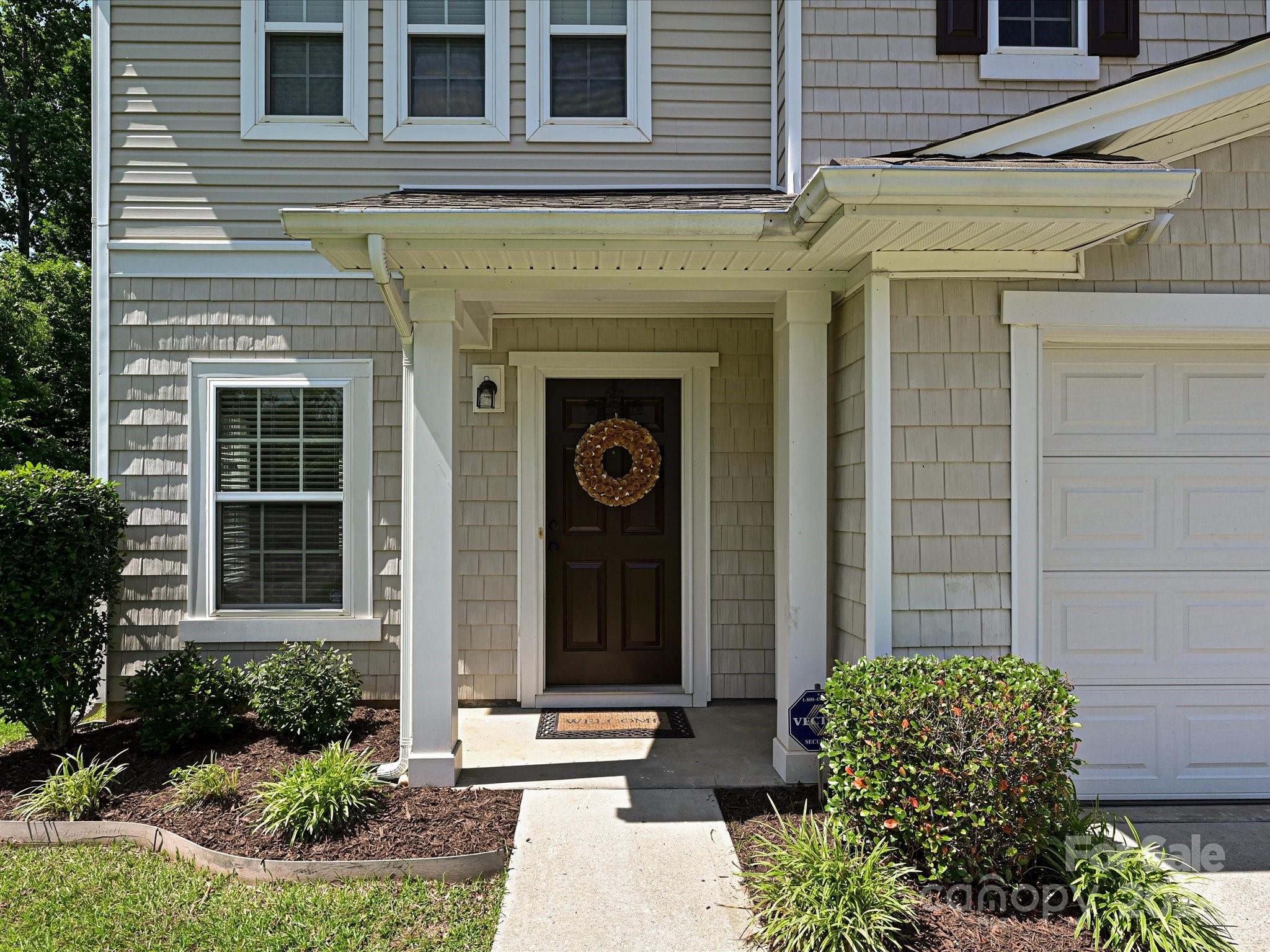 796 Ivy Trail Way Fort Mill, SC 29715 - Photo 2 of 39 front view of a brick house with a large windows