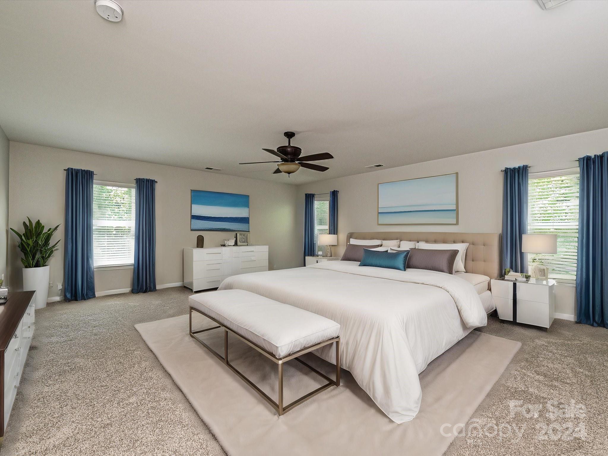 796 Ivy Trail Way Fort Mill, SC 29715 - Photo 24 of 39 a spacious bedroom with a large bed and a chandelier