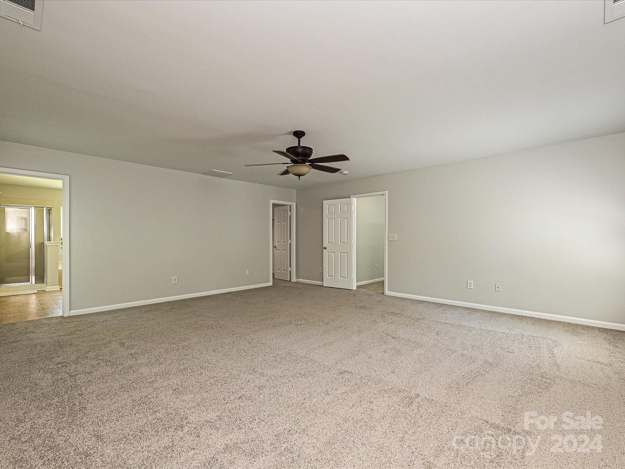 796 Ivy Trail Way Fort Mill, SC 29715 - Photo 25 of 39 a view of an empty room with a ceiling fan