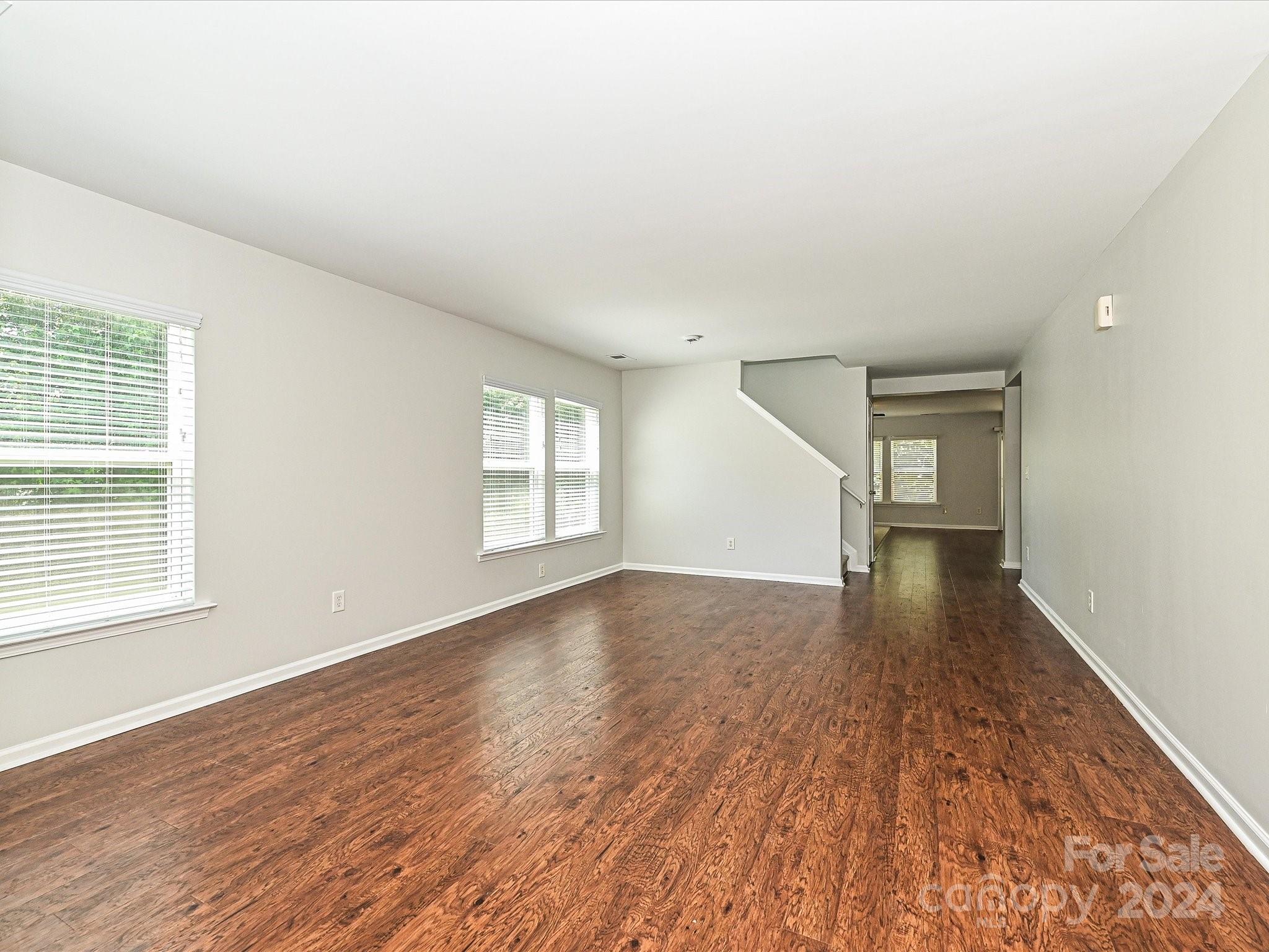 796 Ivy Trail Way Fort Mill, SC 29715 - Photo 3 of 39 wooden floor in an empty room with a window