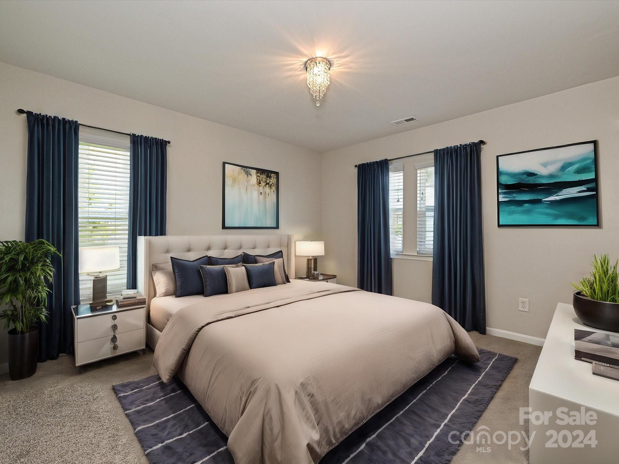 796 Ivy Trail Way Fort Mill, SC 29715 - Photo 31 of 39 a large bedroom with bed and a chandelier