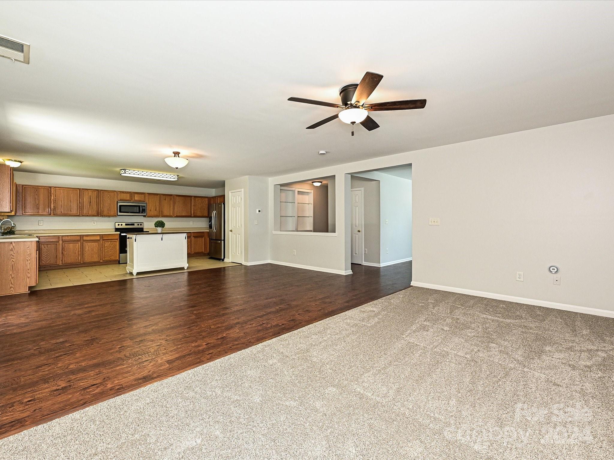 796 Ivy Trail Way Fort Mill, SC 29715 - Photo 10 of 39 a view of a kitchen with furniture and wooden floor