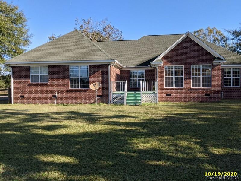 2227 Ridgeway Road Lugoff, SC 29078 - Photo 1 of 12 a front view of a house with a garden