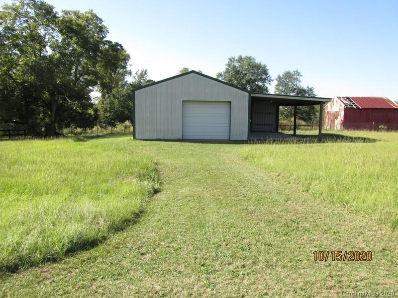 2227 Ridgeway Road Lugoff, SC 29078 - Photo 4 of 12 a backyard of a house with lots of green space