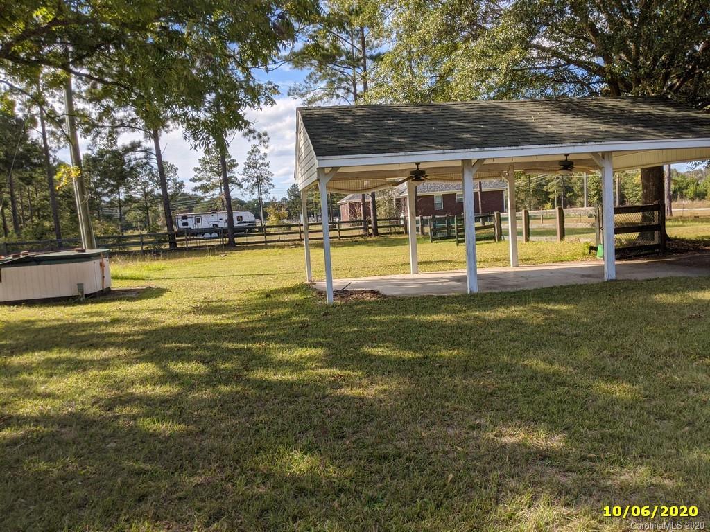 2227 Ridgeway Road Lugoff, SC 29078 - Photo 5 of 12 a view of pool with a big yard and large trees