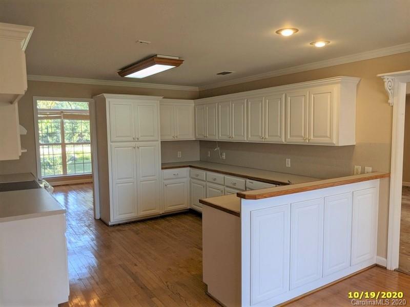 2227 Ridgeway Road Lugoff, SC 29078 - Photo 7 of 12 a kitchen that has a sink a microwave and cabinets