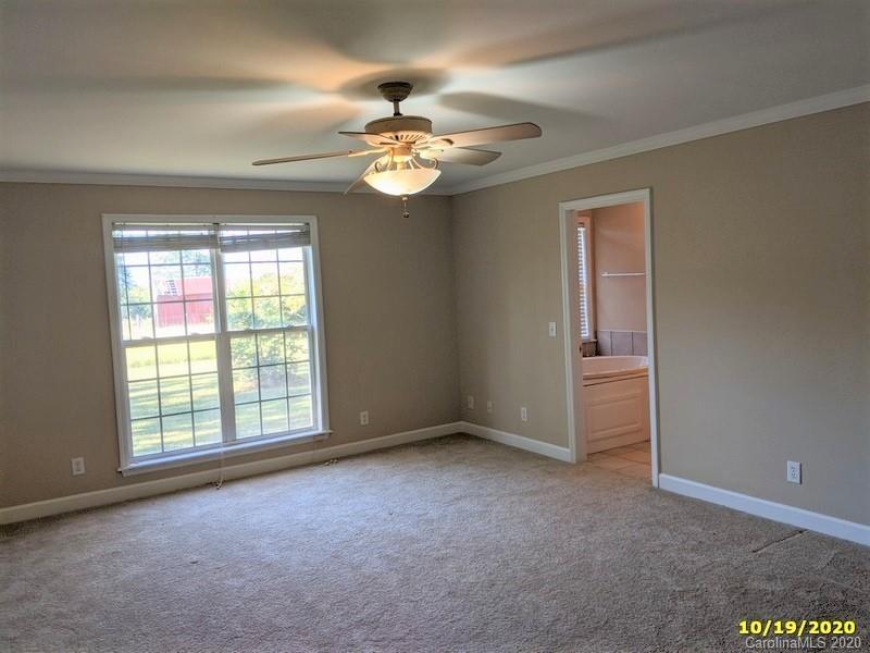 2227 Ridgeway Road Lugoff, SC 29078 - Photo 9 of 12 a view of an empty room with a window