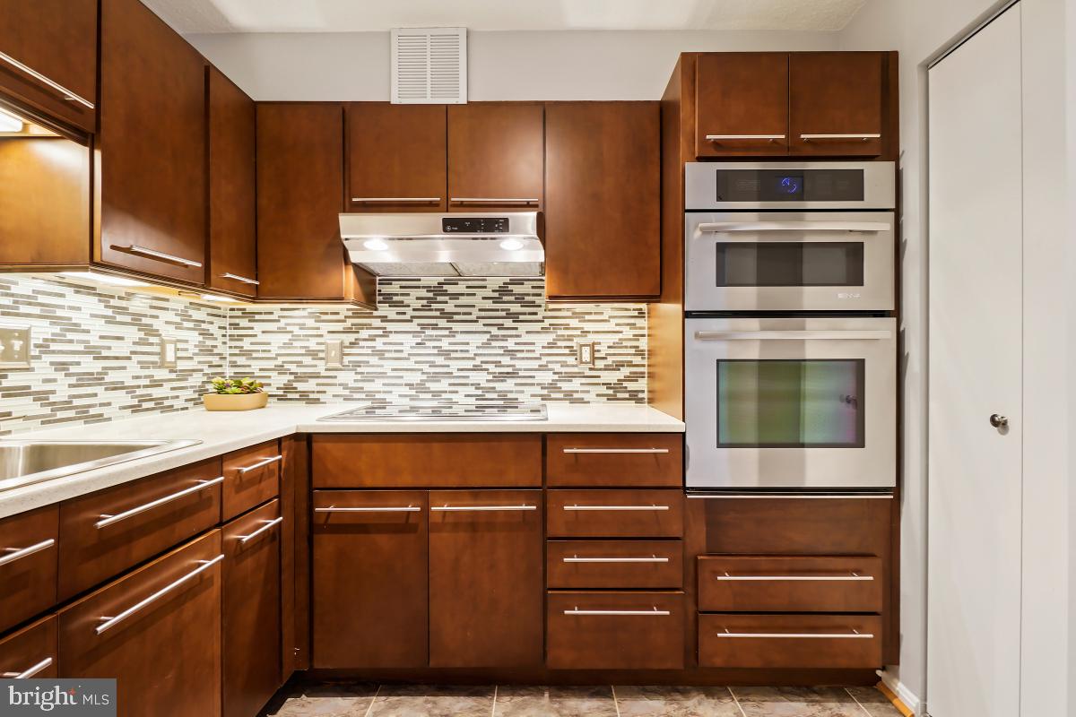 5902 Mt Eagle Drive, Unit 1503 Alexandria, VA 22303 - Photo 14 of 30 Kitchen - Upgraded Countertops and Backsplash